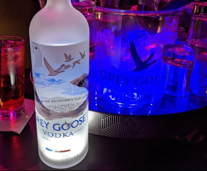 A bottle on a lit ice bucket at a PHC Tampa table